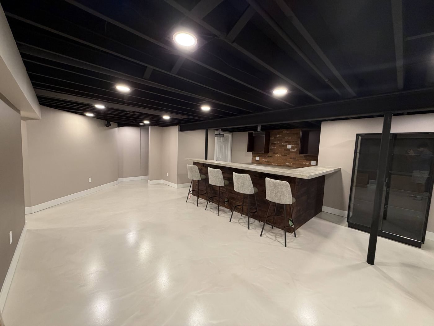 Long finished basement with bar and lounge